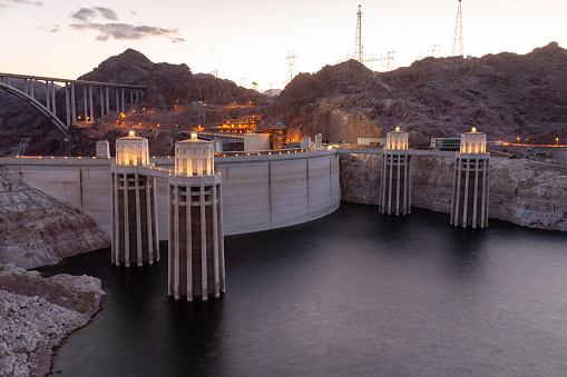 Hoover dam close-up shot. Hoover dam and Lake Mead in Las Vegas area. Large Comstock Intake Towers At Hoover Dam. Hoover Dam in the evening with illuminations without people.