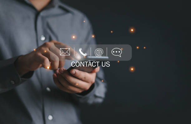 istock Businessman using virtual screen contact icons Contact us or connect customer support hotline. contact, customer, phone, support, online Copy space customer support concept 2050116509
