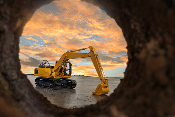 istock Crawler excavator are digging soil in the tunnel construction site. 2050133328