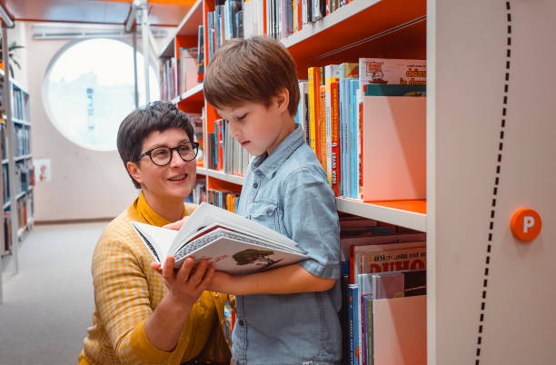 istock Mother and son at the public library 2050156886