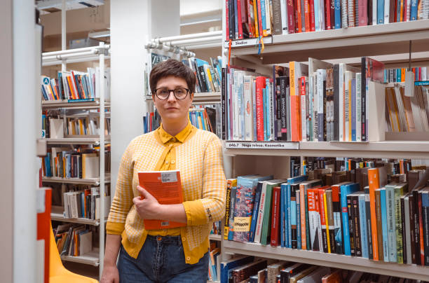 istock Woman portrait in the public library 2050156957