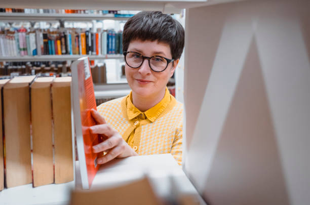 istock Woman portrait in the public library 2050157480