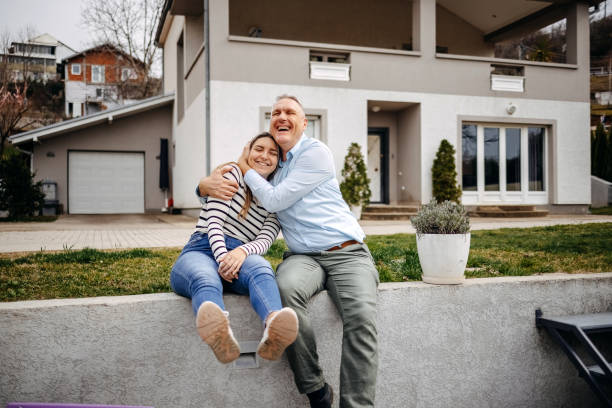istock Father with grown up daughter outside home having fun 2050190934