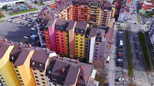 AERIAL Drone Shot of Apartment Buildings Painted in Different Colors in Town, Slovenia