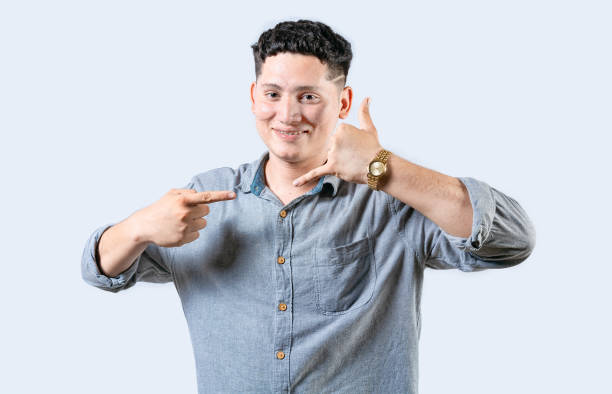 istock Interpreter person gesturing CALL ME in sign language isolated. Smiling people gesturing CALL ME in sign language 2050209039