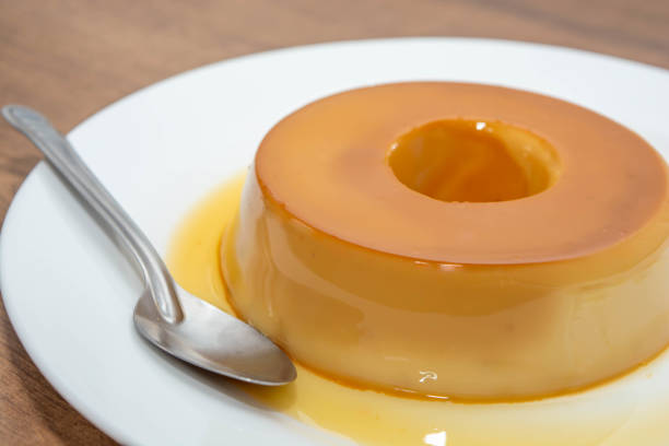 istock Delicious homemade pudding on rustic wooden surface 2050209066