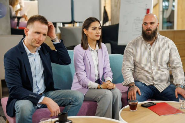 istock Human resources team interviewing young female job applicant in modern office 2050211838