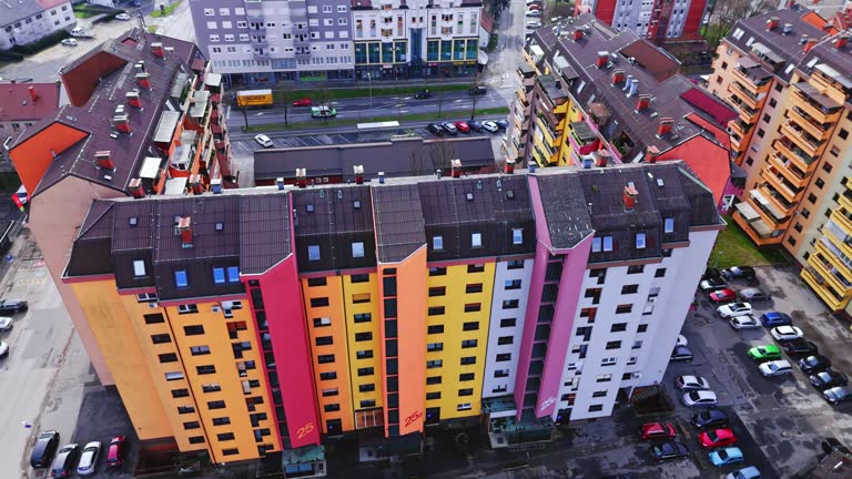 AERIAL Drone View of Residential Complex Painted in Different Vibrant Colors in Town, Slovenia