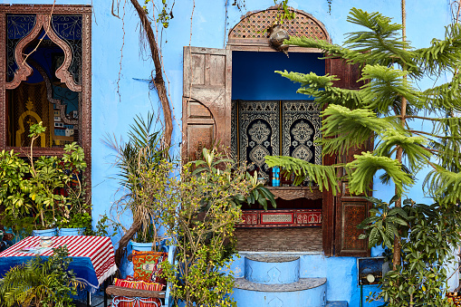 Street side traditional decorated restaurant interior in Chefchaouen, Morocco, North Africa.