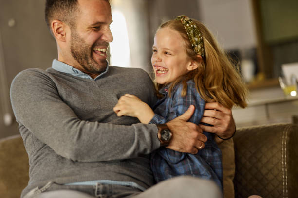 istock Cheerful father and daughter having fun at home. 2050237752