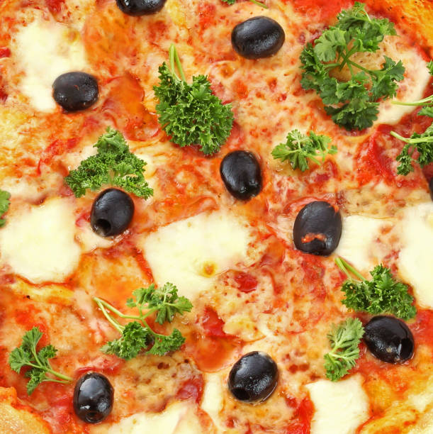 pizza with olives background close up