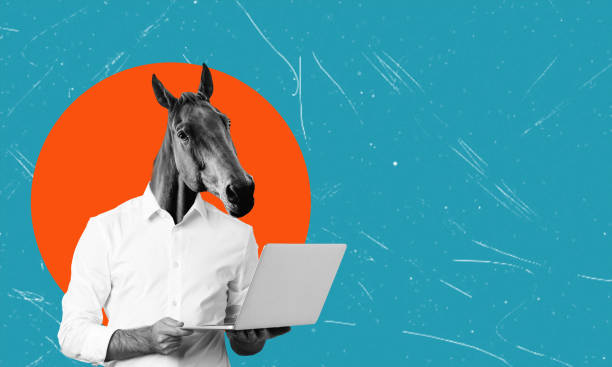 istock Art collage, man with horse head with laptop on blue background with space for text. 2050247971