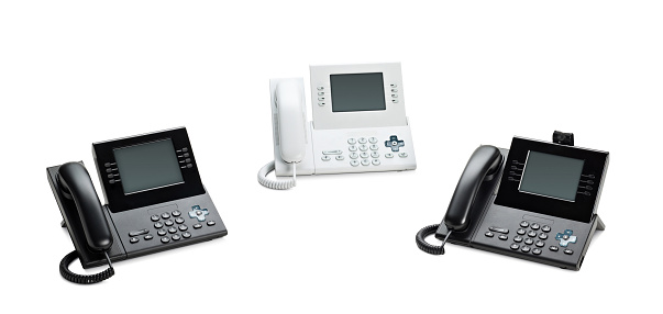 Office IP telephones set with LCD display isolated on white