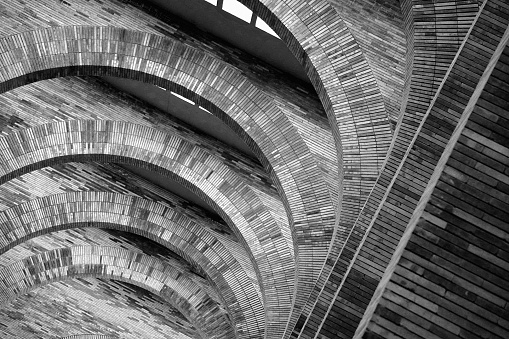 Architectural abstract, Modern splayed brick arches diminishing perspective, black and white