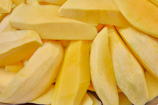 Full frame shot of ripe mango sliced on plate