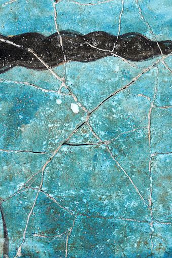 Turquoise colour with black wave, Old cracked plaster wall background texture