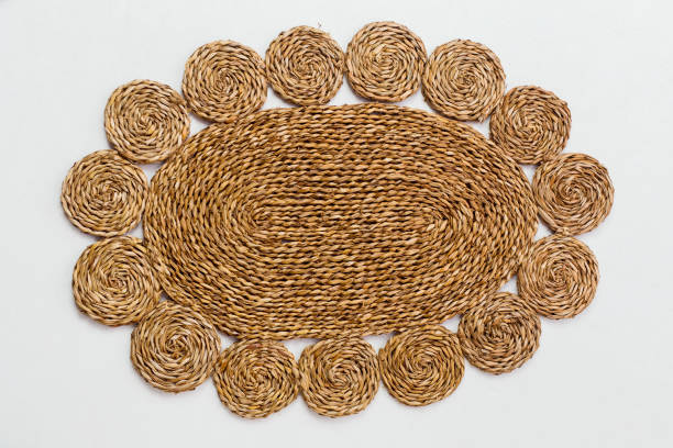 istock Closeup of a straw rug on a white background 2050284422