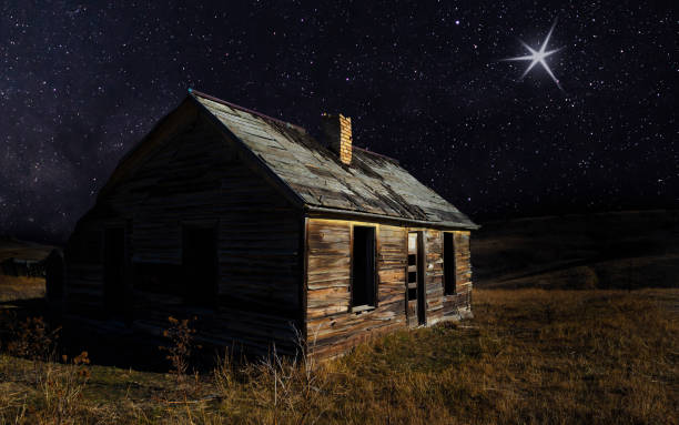 istock Shininng light om a starry night above a house 2050296035