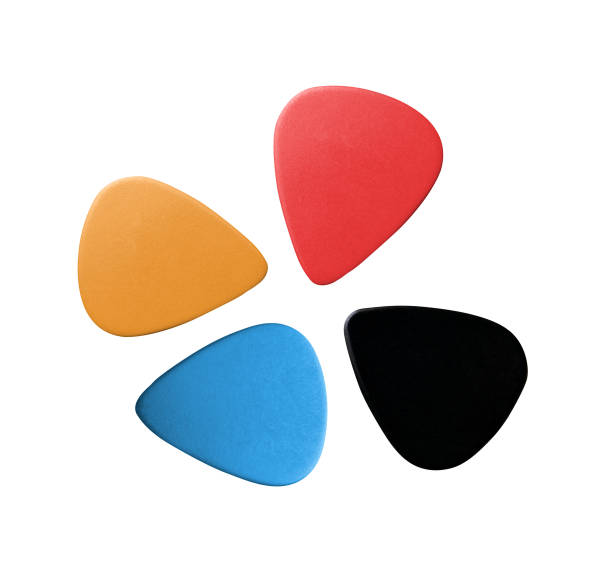 single guitar plectrum in purple colour isolated on white background.