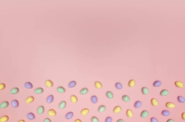 istock Top view of colourful easter eggs on pink background. 2050305991