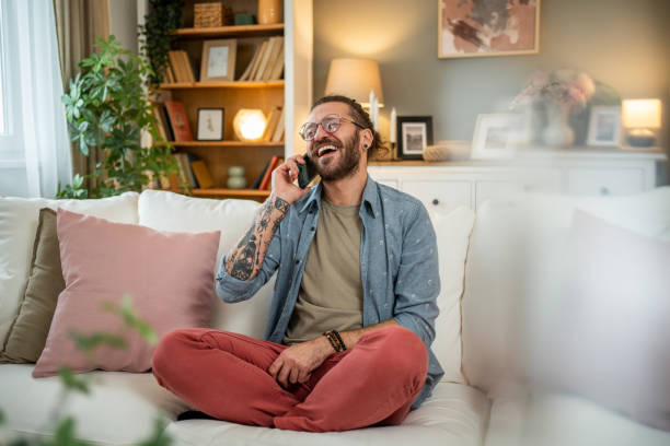 istock Man sitting at home in bed and scrolling social media 2050319748