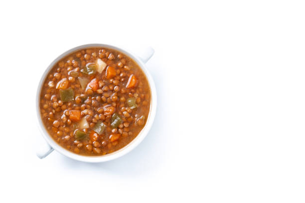 istock Lentil soup with vegetables in bowl isolated on white background 2050342359