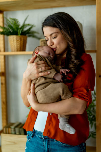 istock Young mom holding her sleepy baby boy. 2050356101