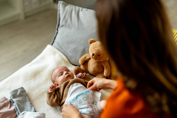 istock Baby in bedroom getting diaper changed 2050358717