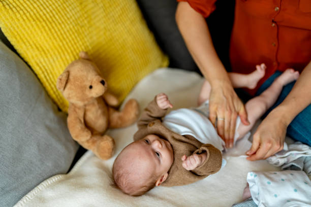 istock Mother changing diaper baby boy. 2050358735