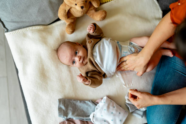 istock Baby in bedroom getting diaper changed 2050359252