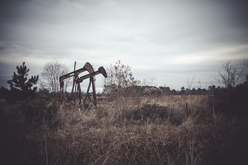 Abandoned vintage gas pumps and gas station in the desert.