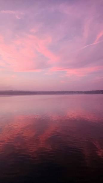 istock Beautiful pink sunset reflection in the sea 2050366656