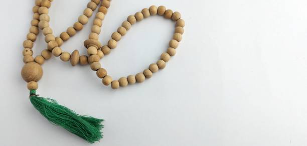 istock prayer beads from a wooden beads on a white background 2050369916