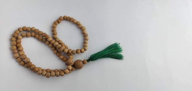 istock prayer beads from a wooden beads on a white background 2050369925