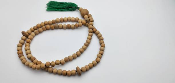 istock prayer beads from a wooden beads on a white background 2050370582