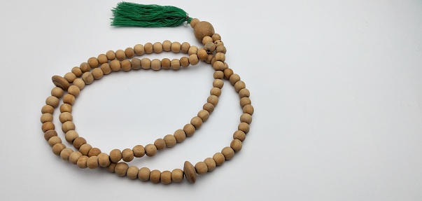prayer beads from a wooden beads on a white background