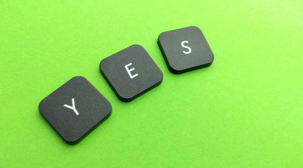 istock yes word written on green keyboard buttons 2050376284