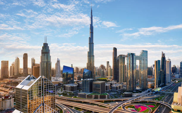 Dubai skyline at sunset with traffic - aerial view, United Arab Emirates Dubai skyline at sunset with traffic - aerial view, United Arab Emirates khalifa stock pictures, royalty-free photos & images