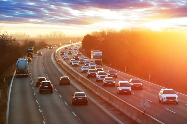 istock Transportation trucks in high speed driving on a highway through rural landscape. Freight scene on the motorway 2050410313