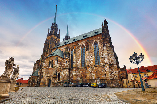 Rainbow over Cathedral of St Peter and Paul in Brno, Moravia, Czech Republic. Famous landmark in South Moravia.
