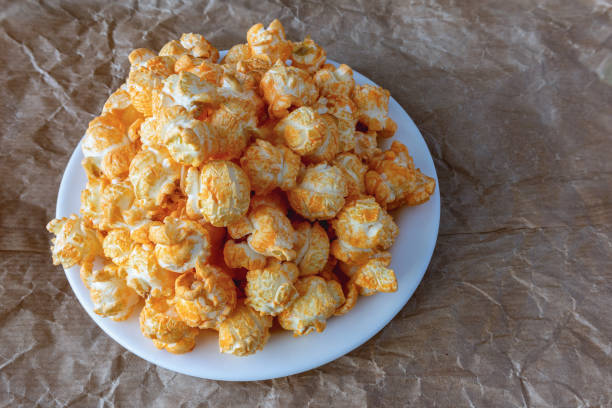 istock Popcorn with cheddar cheese flavor on a plate 2050421829