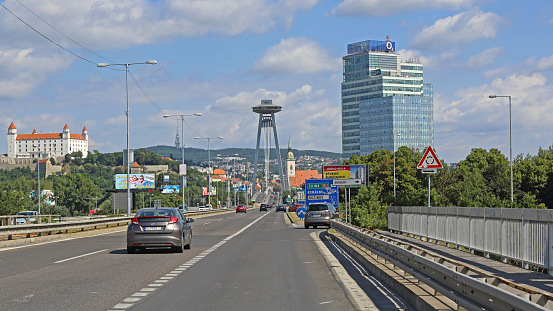 Bratislava, Slovakia - July 10, 2015: Castle and SNP Pylon Bridgeand O2 Office Skyscraper Building Summer Day Cityscape.