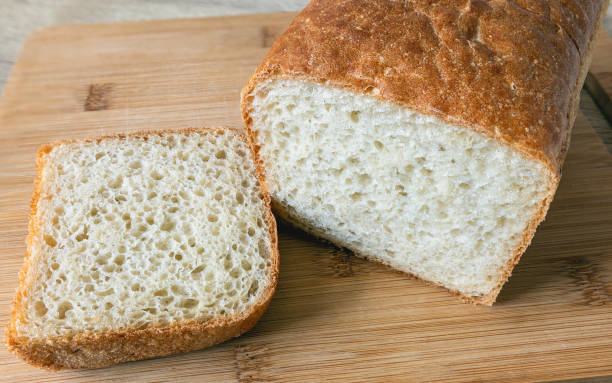 istock Cut a loaf of white bread with a slice 2050425598
