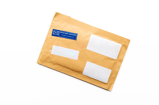 Padded envelope top view isolated on white background, cardboard bag, package paper letter.