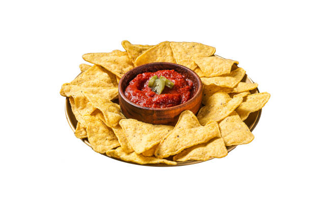 istock Nachos chips with tomato sauce and jalapeno, mexican appetizer. Isolated on white background. Top view. 2050464855