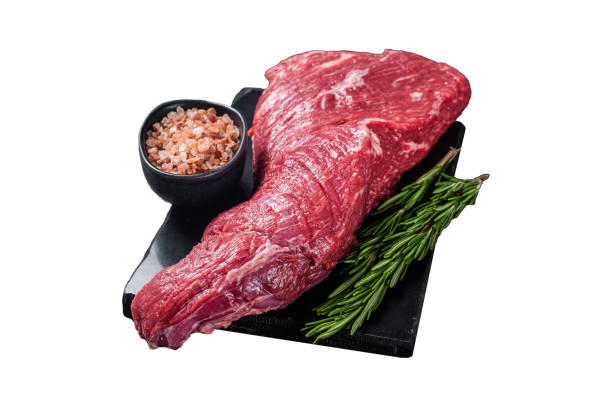 istock Raw American Tri Tip beef steak on marble board.  Isolated on white background. Top view. 2050464876