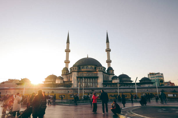 Istanbul, Turkey-February,22: The nostalgic tram in Taksim Square, Taksim Mosque, People in the Taksim Square