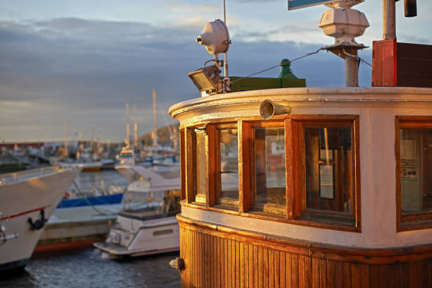 Classic steamboats navigating the waters of saltsjön, with the cityscape of stockholm in the background