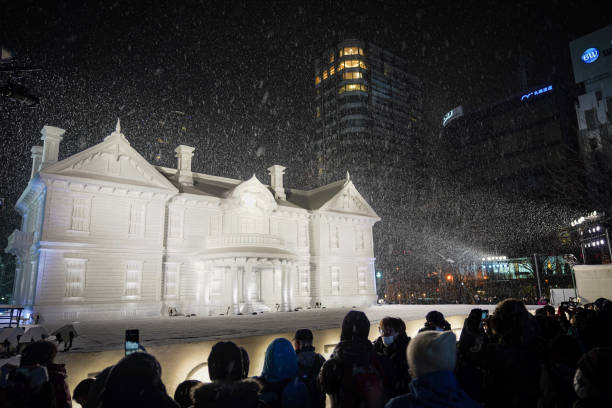 tourist enjoy exhibitions at snow festival Sapporo Hokkaido Japan
