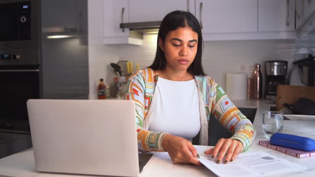 young woman studies concentrated at home